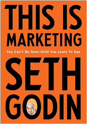 Aceasta este o captură de ecran a copertei This Is Marketing de Seth Godin. Coperta este un dreptunghi vertical cu fundal portocaliu și text negru. O fotografie a capului lui Seth apare în O al numelui său de familie.